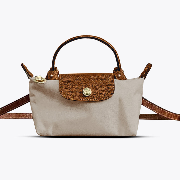 Stylish women's mini leather crossbody bag in black, featuring an elegant design and practical adjustable shoulder strap.