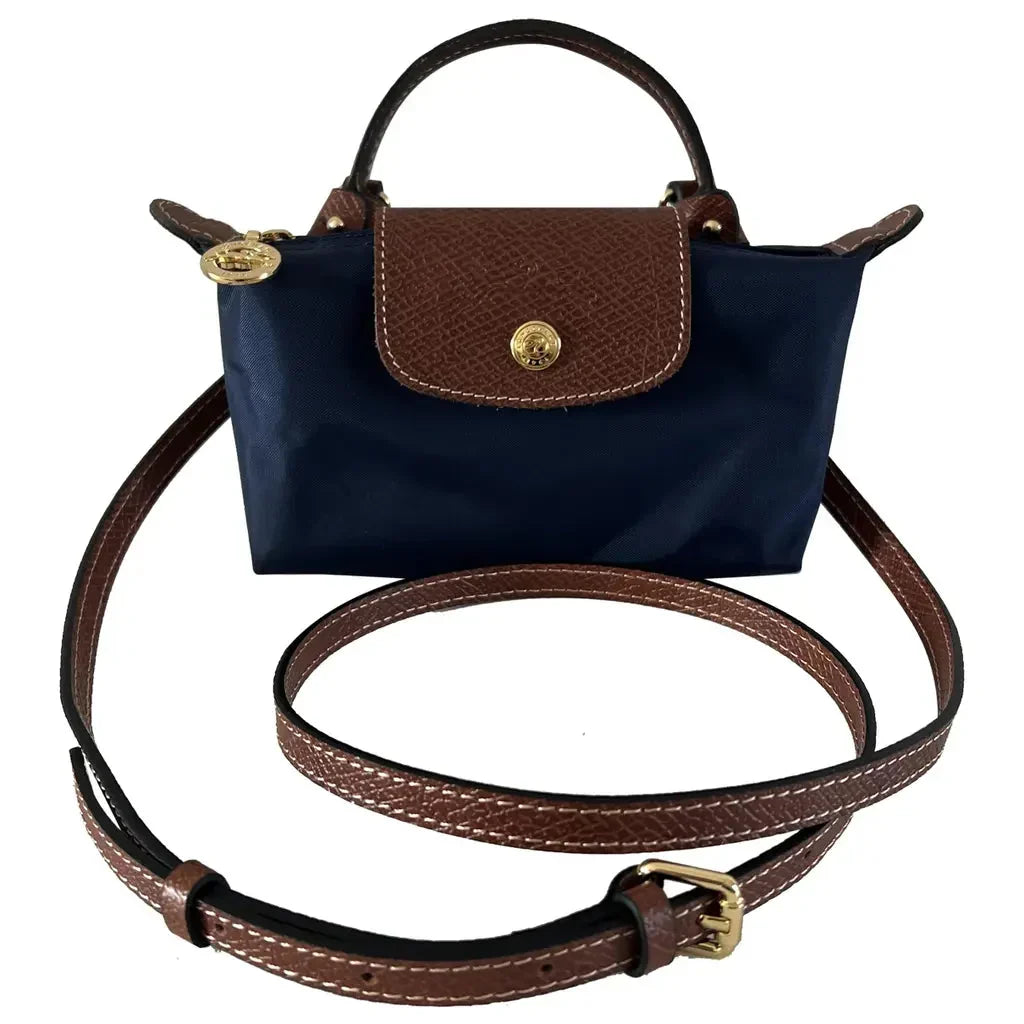 Women's versatile black leather mini crossbody bag, combining elegant design with a comfortable adjustable strap for daily wear.