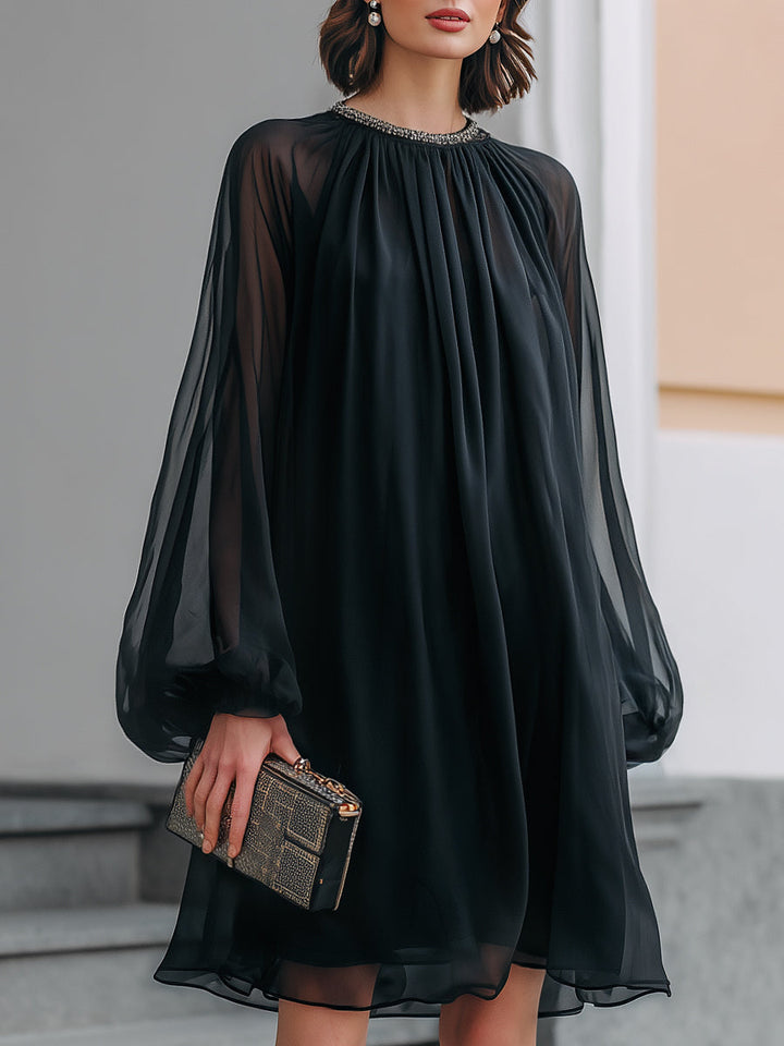 Elegant women's black mini dress with embellished neck and stylish balloon sleeves for cocktail parties.