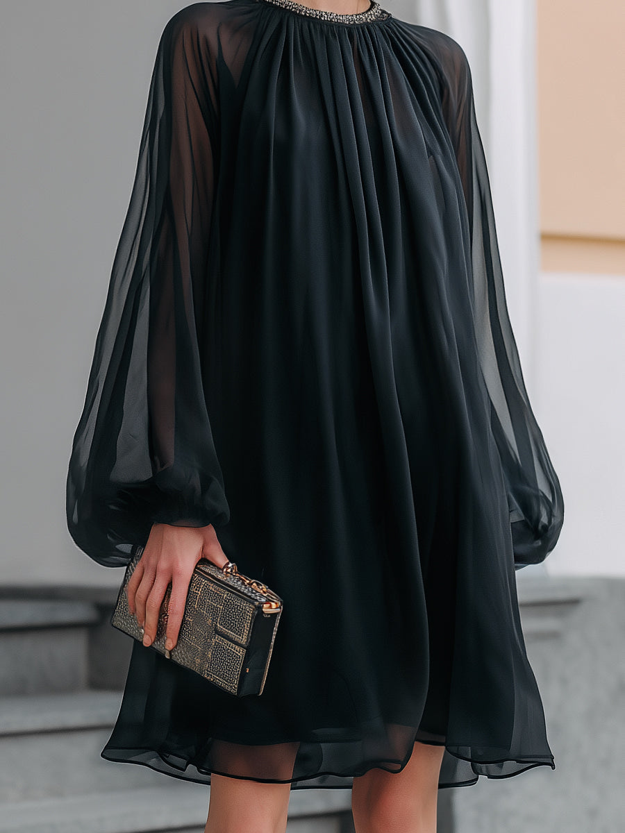Flattering women's black mini dress with embellished neckline & elegant balloon sleeves, ideal for cocktail parties.