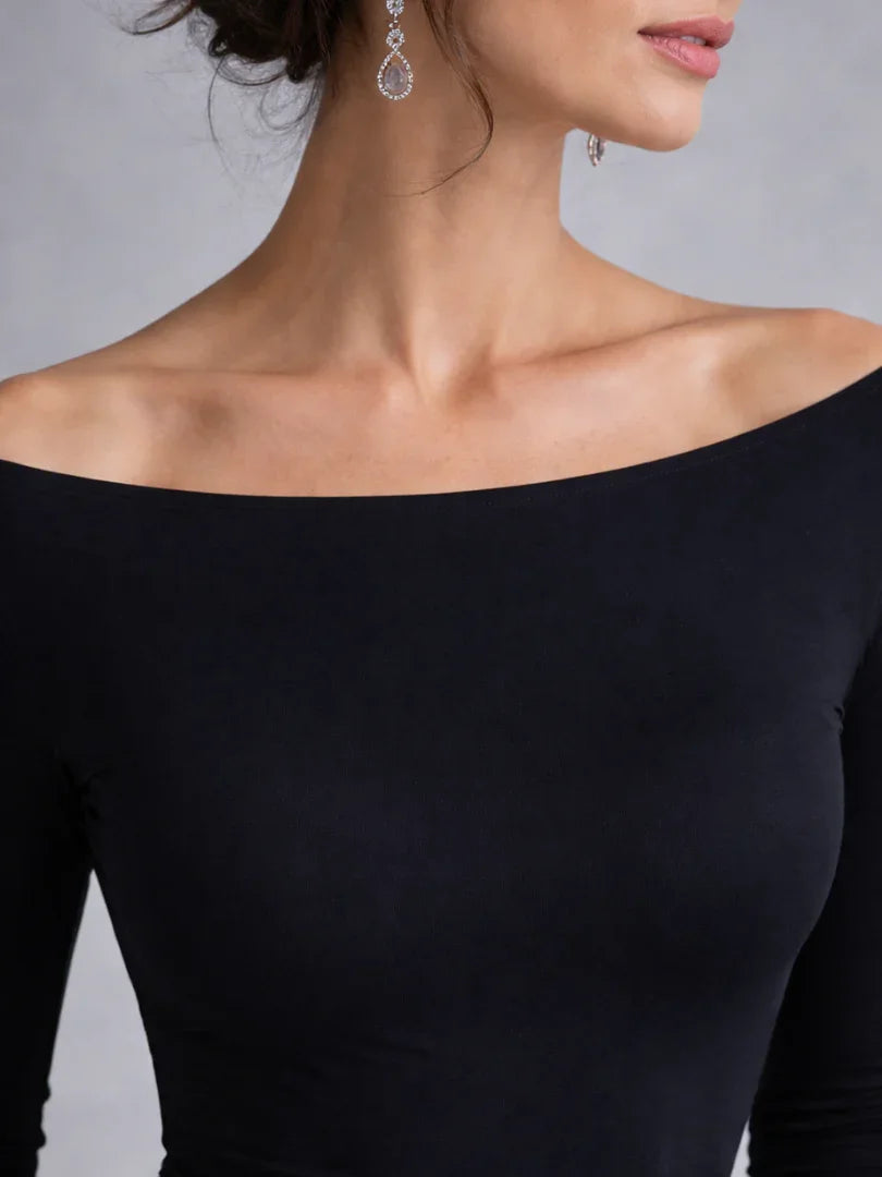 Chic women's black off-shoulder long sleeve maxi dress, perfect as a party dress or wedding guest attire.