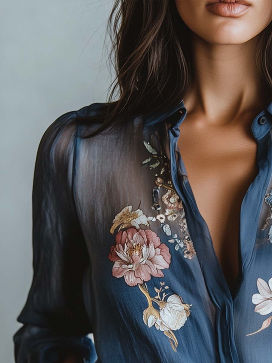Relaxed fit V-neck women's blouse showcasing beautiful floral embroidery and stylish sheer long sleeves.