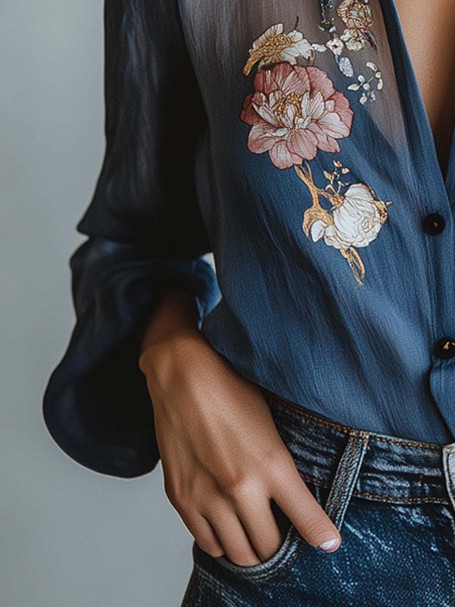 Intricately embroidered floral women's blouse with elegant sheer long sleeves. Flattering V-neck and relaxed fit.