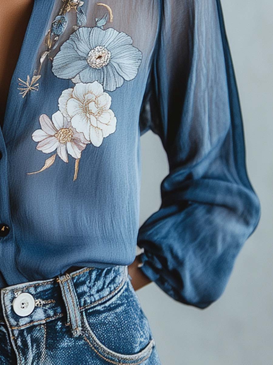 Fashionable women's blouse with stunning floral embroidery, elegant sheer long sleeves, and a chic V-neck design.