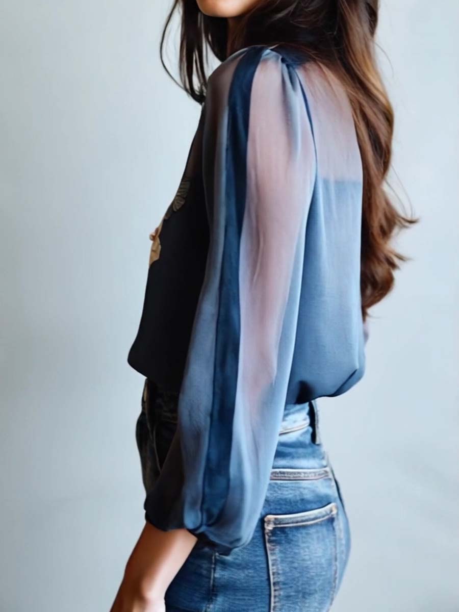 Women's long sleeve V-neck blouse with exquisite floral embroidery & delicate sheer sleeves. Feminine and chic.