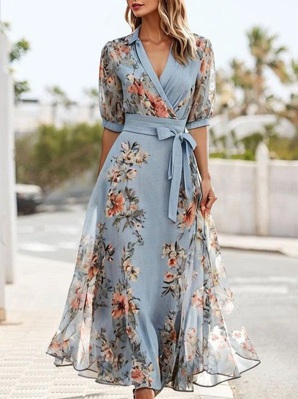 Elegant women's blue floral wrap maxi dress with V-neck, puff sleeves, and tie waist. Perfect for summer events.