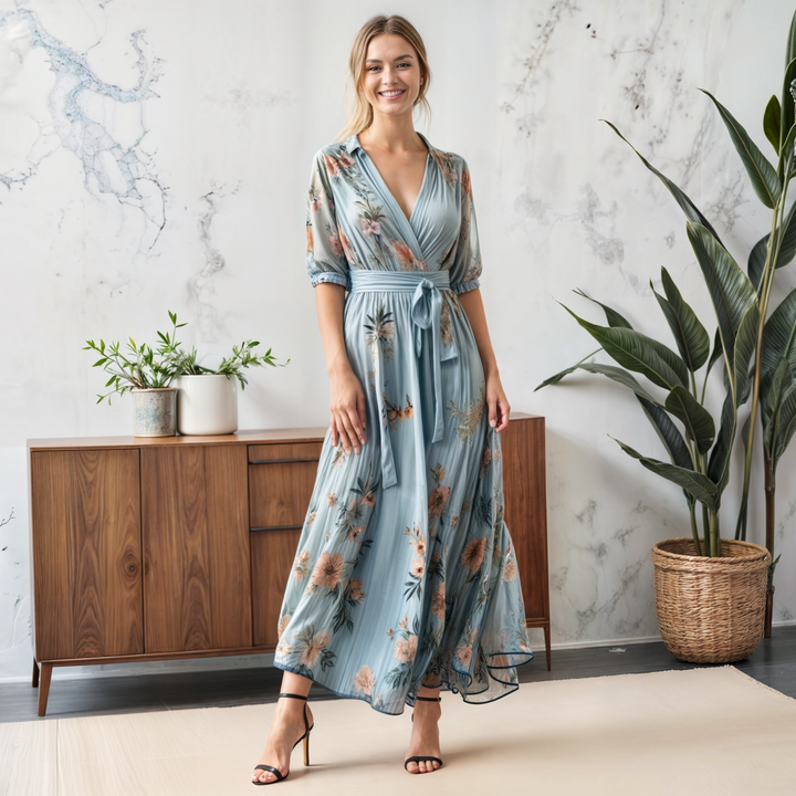 Women's A-line blue floral maxi dress with flattering V-neck, puff sleeves & tie waist. Ideal casual or guest attire.