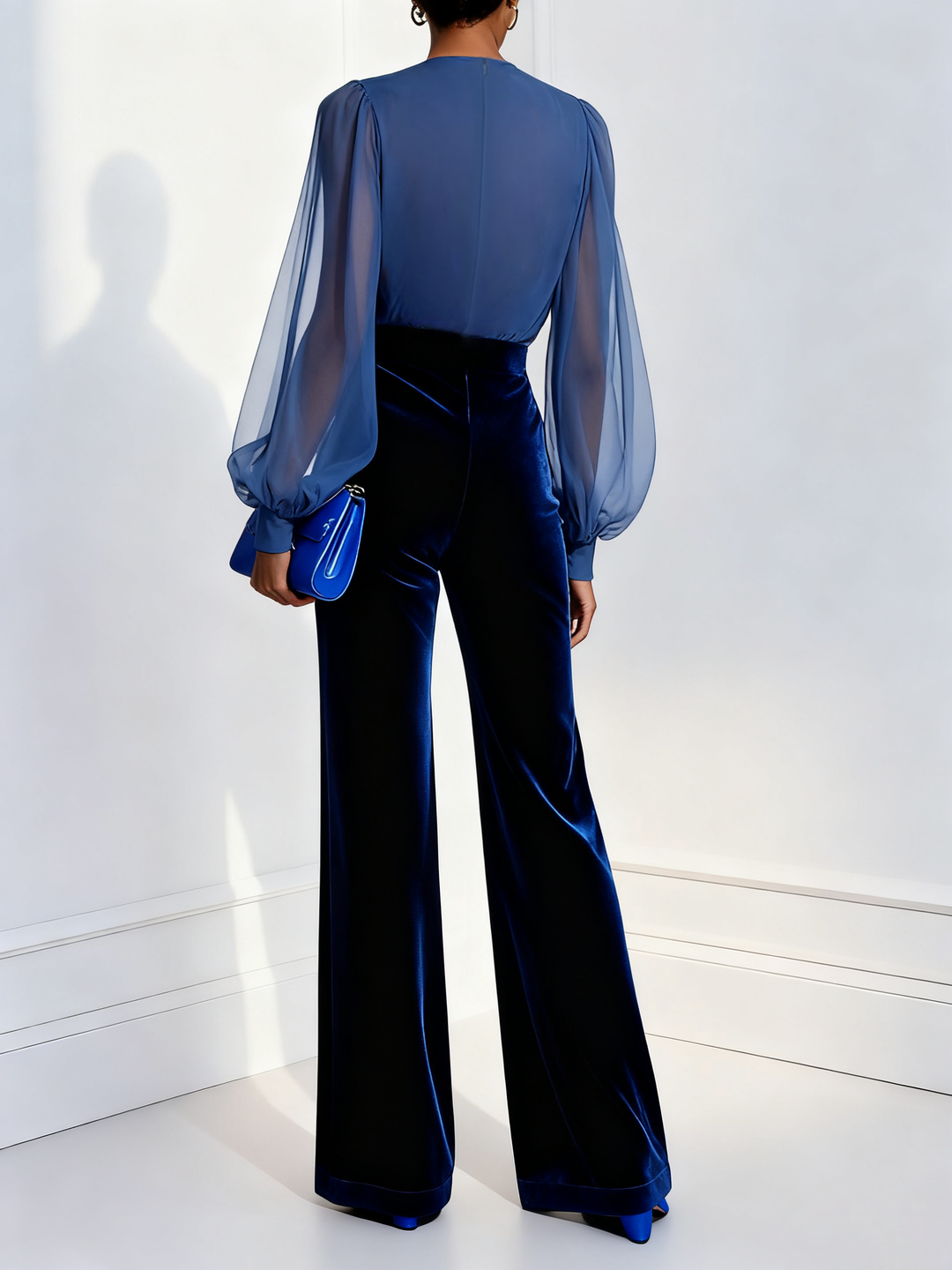 Sophisticated blue wide-leg jumpsuit for women with a long sleeve mesh V-neck, ideal for formal parties & evening wear.
