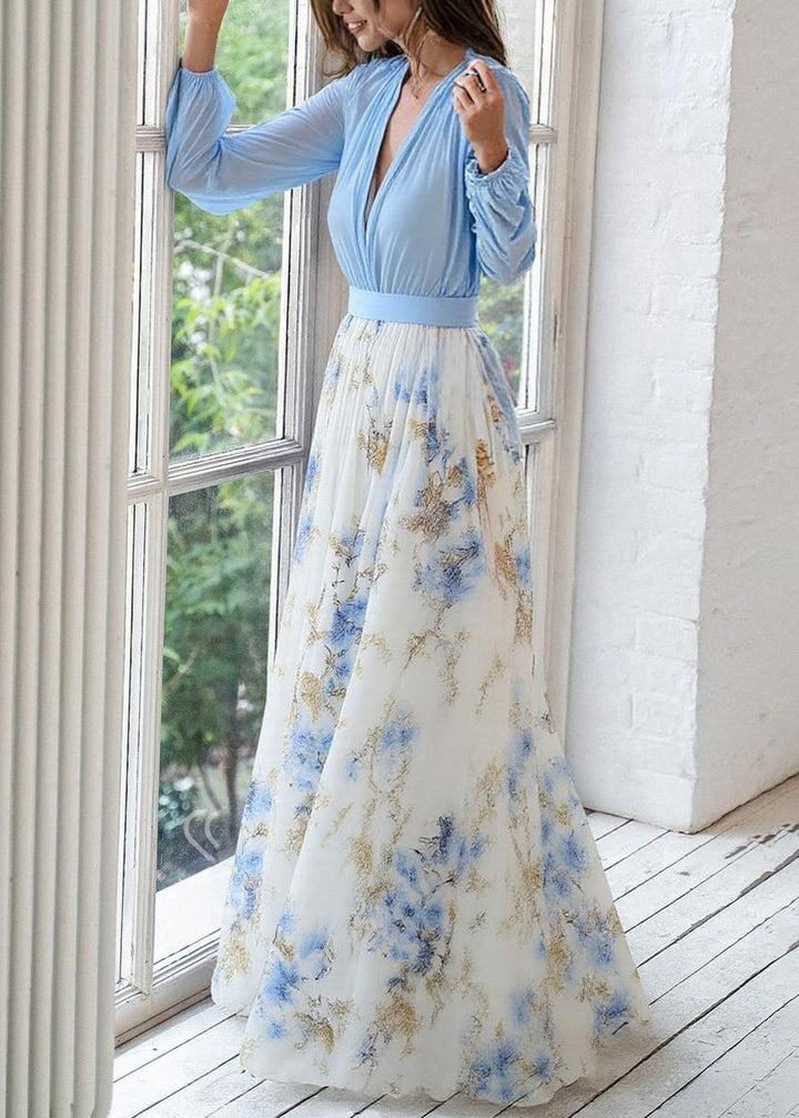 Flowing women's long-sleeve maxi dress with a deep V-neck & floral print; a versatile and casual blue dress.