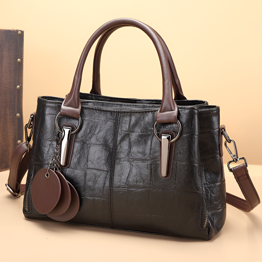 Versatile women's Boston bag featuring trendy croc embossing, a must-have fashion accessory for any outfit.