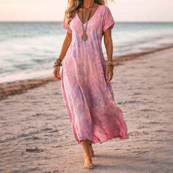 Flowy women's boho floral maxi dress with a V-neck, ideal for casual summer wear & festivals.