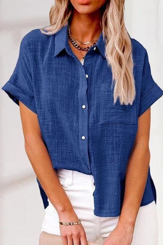 Polished women's buttoned shirt, an elegant long-sleeve top ideal for business casual and office apparel.