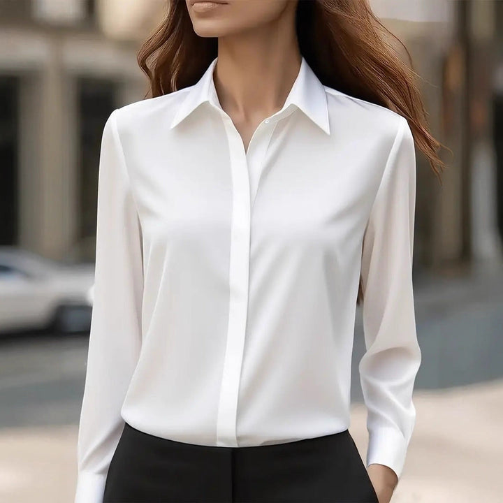 Fashionable women's button-front work blouse. Elegant long sleeve top for office style & professional appeal.
