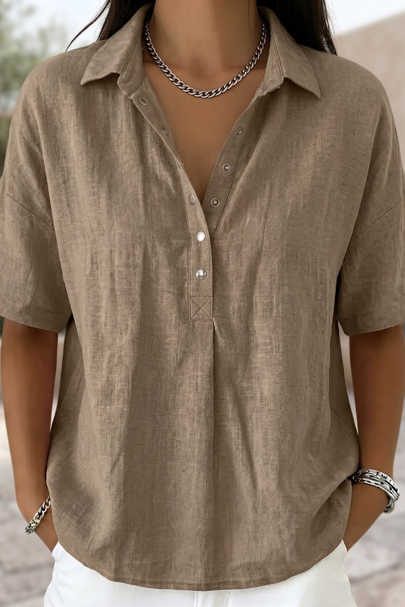 Elegant women's button-front blouse. Stylish long-sleeve top for versatile workwear & casual fashion.