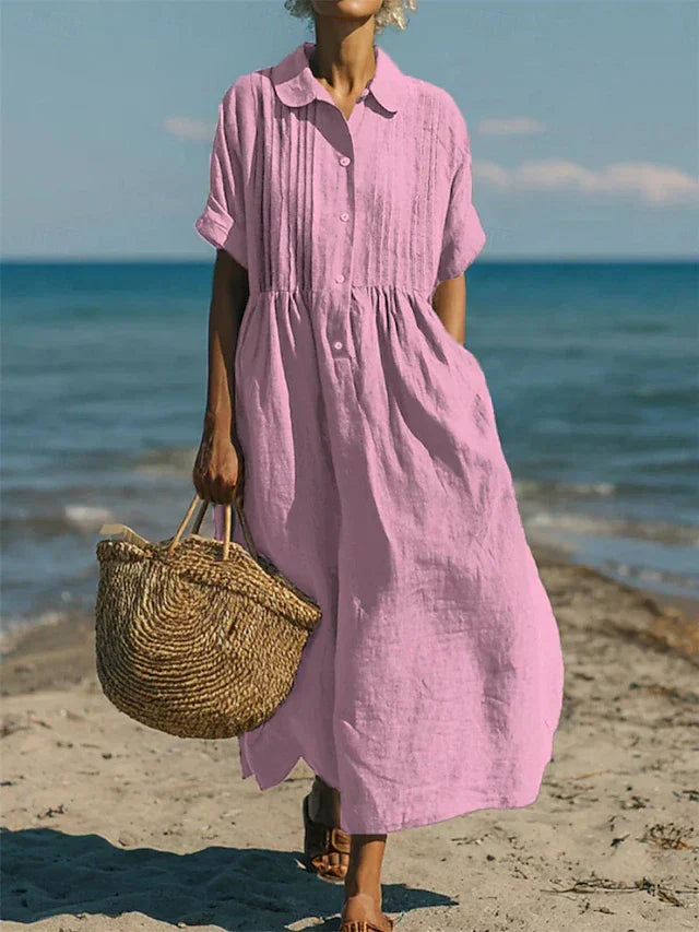 Women's long pleated maxi dress with a stylish button-front and elegant collared neckline.