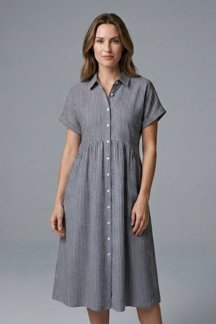 Flowy women's long collared midi dress, button-front, designed for comfort and sophisticated style.