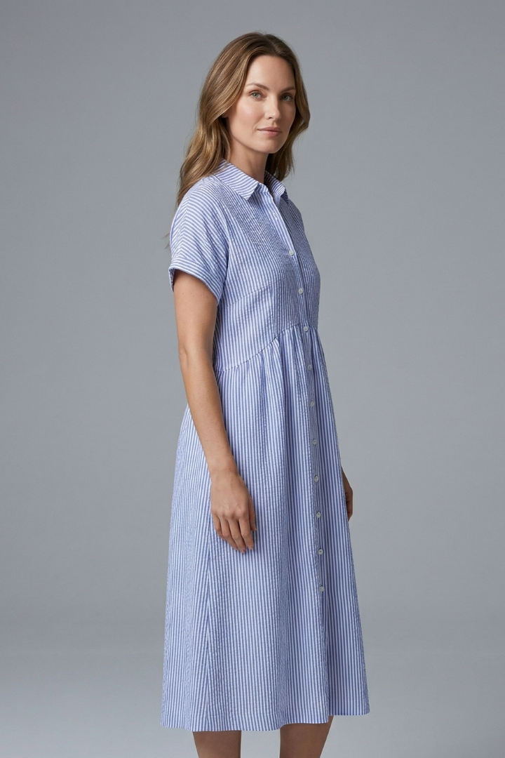 Fashionable women's midi dress with button details and a chic collar, great for summer style.