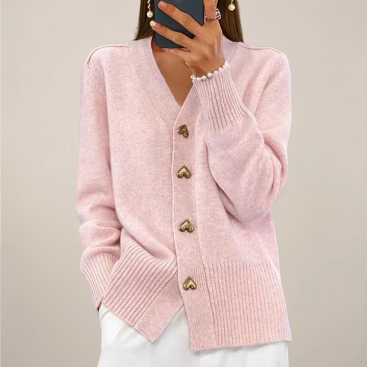Chic women's layering cardigan, elegant design with distinctive gold heart buttons.