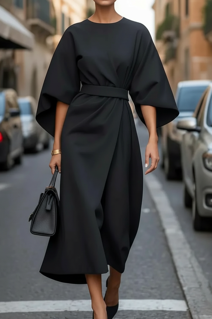 Elegant women's midi cocktail dress styled with accessories, suitable for evening parties & special occasions.