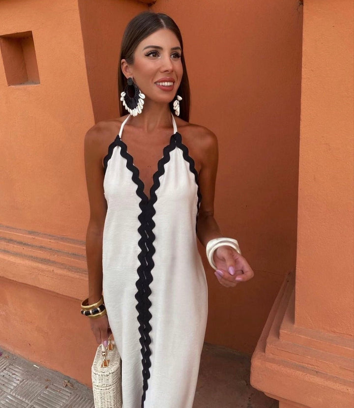 Stylish long V-neck maxi wedding guest dress with contrast trim, perfect for resort or summer party wear.