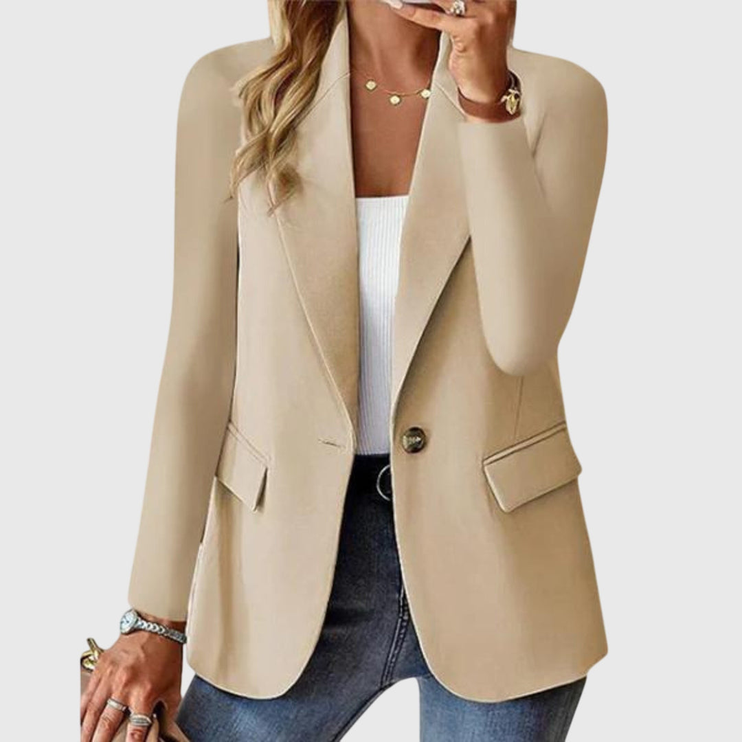 Full-length shot of a woman in a classic single-breasted blazer with notch lapel. Perfect elegant office & business wear.