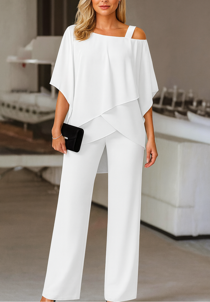 Stylish women's two-piece cold-shoulder top and matching pants set for a sophisticated, modern look.