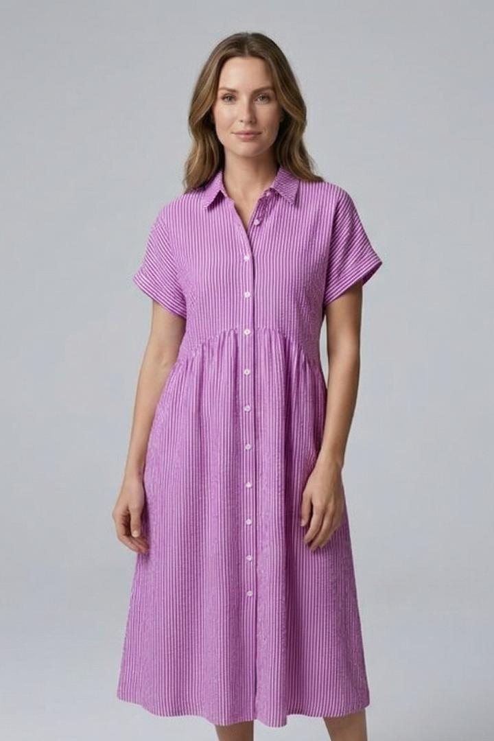 Side profile of a woman wearing the chic collared button-front midi dress, perfect for versatile fashion.
