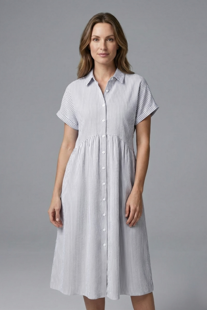 Fashionable women's midi dress, collared and button-front, offering elegant and versatile styling.