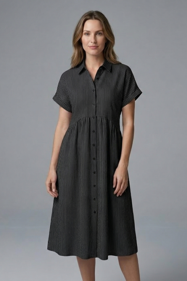 Full-length shot of the women's elegant midi dress, a chic collared button-front design for any occasion.