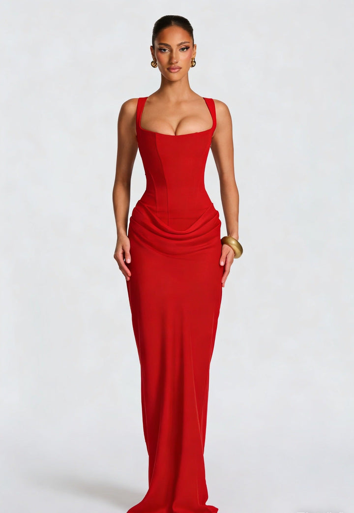 Women's elegant party maxi dress. Features a flattering corset bodice, wide straps, and a long, flowing skirt.
