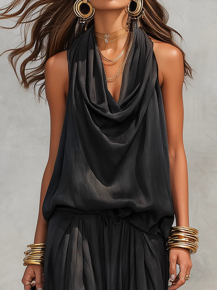 Chic women's cowl neck halter top with wide leg pants. A comfortable and elegant resort wear set.