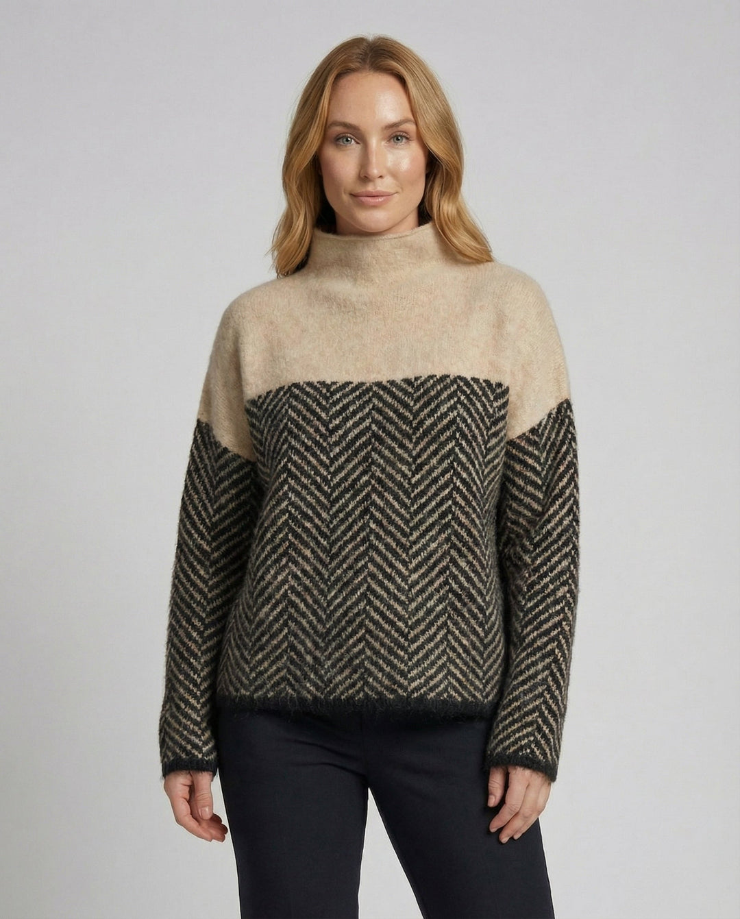 Loose fit women's chic turtleneck sweater, perfect for comfortable and versatile winter wear.