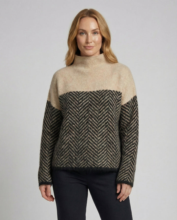 Loose fit women's chic turtleneck sweater, perfect for comfortable and versatile winter wear.