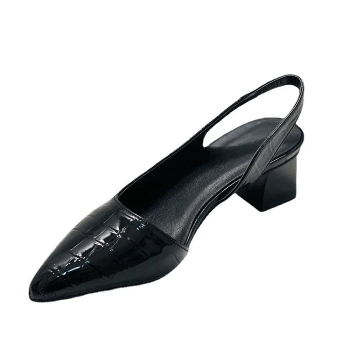 Detailed view of elegant croco print women's slingback heels, showcasing chic texture & comfortable design.