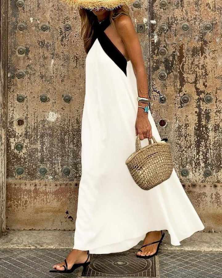 Sophisticated women's flowy summer dress, cross-neck and A-line design, a must-have for elegant casual wear.