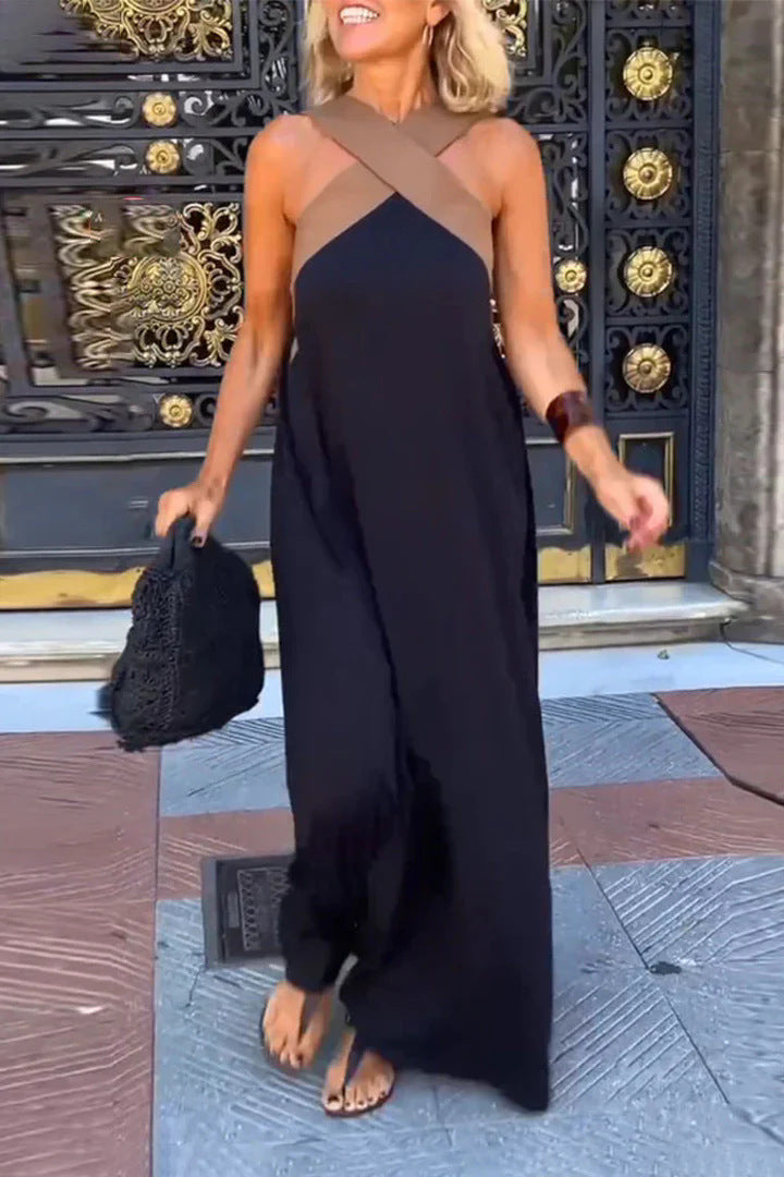 Elegant women's cross neck maxi dress in a flowing fabric, perfect for evening or casual wear.