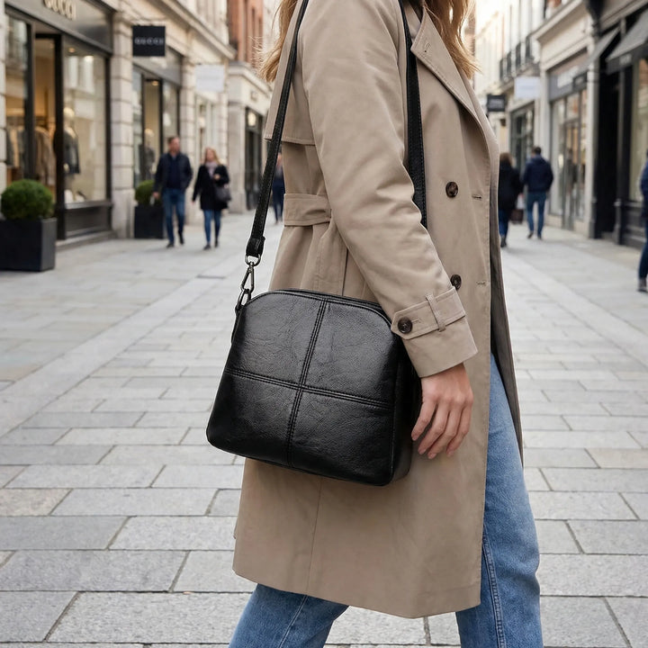 Elegant women's crossbody shoulder bag with unique stitched design, perfect for a stylish and versatile look.