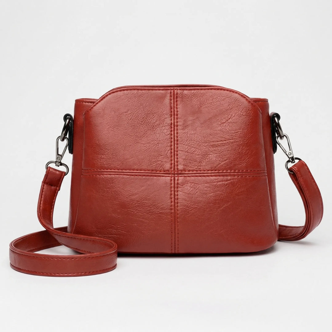 Fashionable mini women's crossbody purse, featuring a detailed stitched design for an elegant accessory.