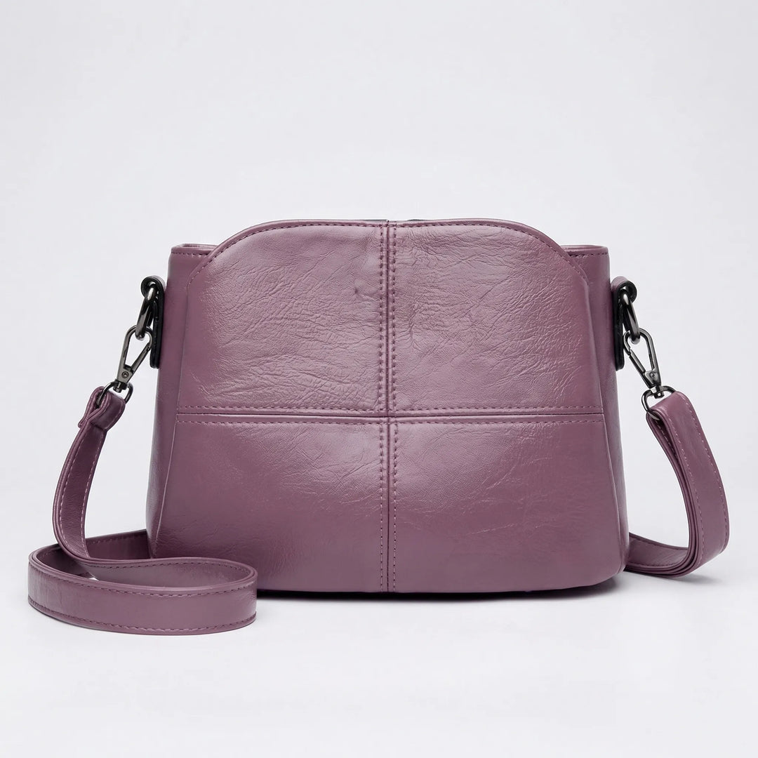 Stylish women's handbag: a versatile crossbody shoulder bag with an intricate stitched pattern for daily fashion.