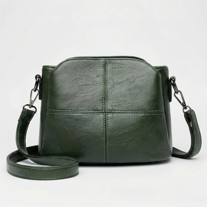 Women's stitched design crossbody bag, also wearable as a shoulder bag, adding a stylish touch to any outfit.