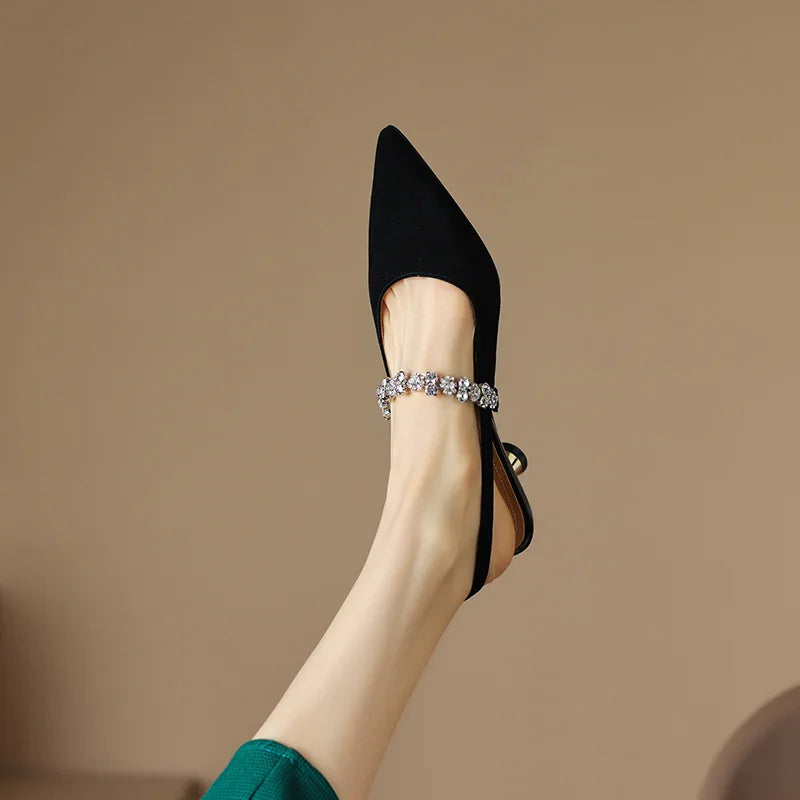 Stunning women's pointed toe slingback heels, adorned with a brilliant crystal strap, ideal for formal attire.