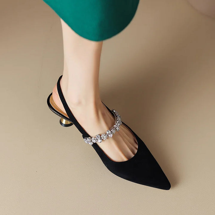 Luxurious women's evening heels: pointed toe, secure slingback, and an eye-catching crystal embellished strap.