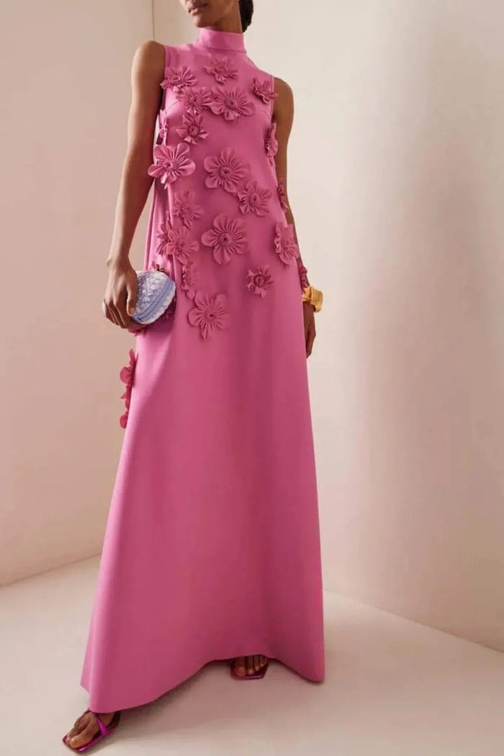 Elegant women's dark pink maxi dress with intricate 3D floral appliqué, structured neckline & relaxed fit, perfect for occasions.