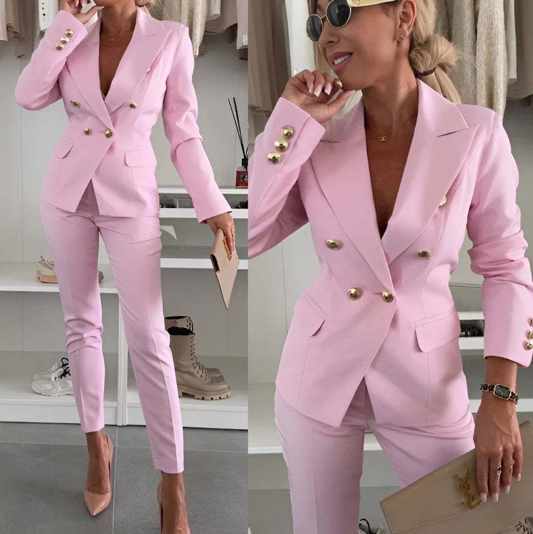 Woman in elegant double-breasted suit set, showcasing sophisticated modern office wear.