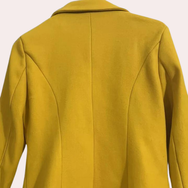 Classic double-breasted women's trench coat, cinched waist, ideal elegant outerwear for fall and winter.