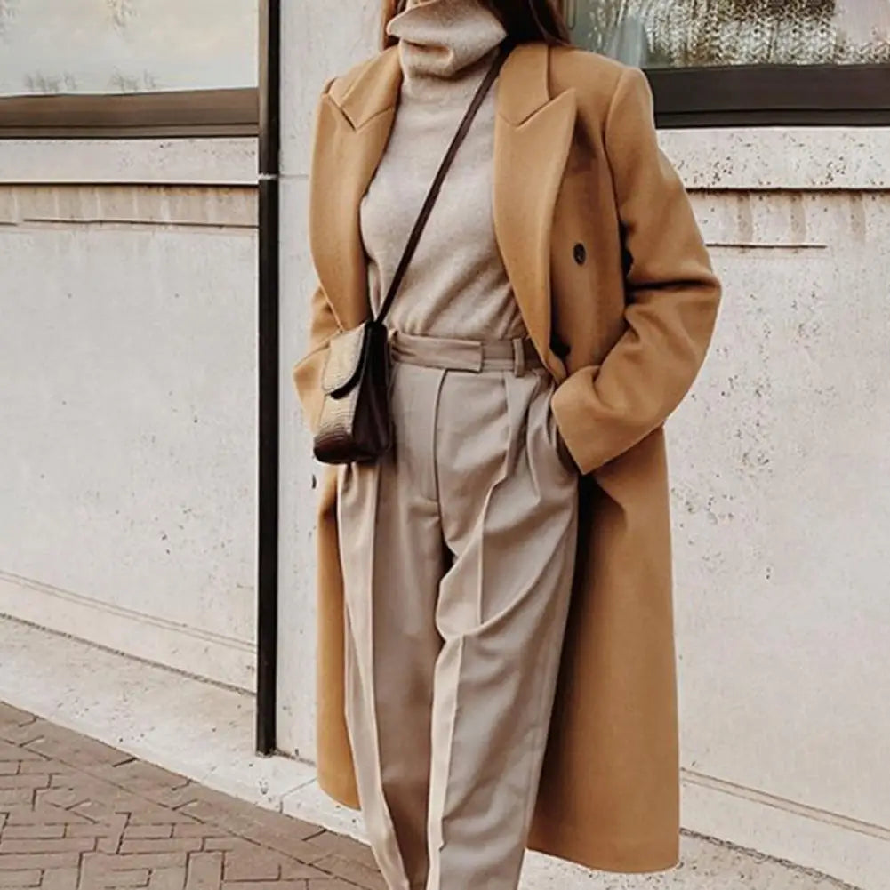 Classic women's double-breasted trench coat with notch collar. Lined, ideal spring/fall jacket or workwear outerwear.