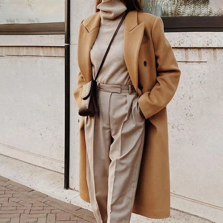 Classic women's double-breasted trench coat with notch collar. Lined, ideal spring/fall jacket or workwear outerwear.