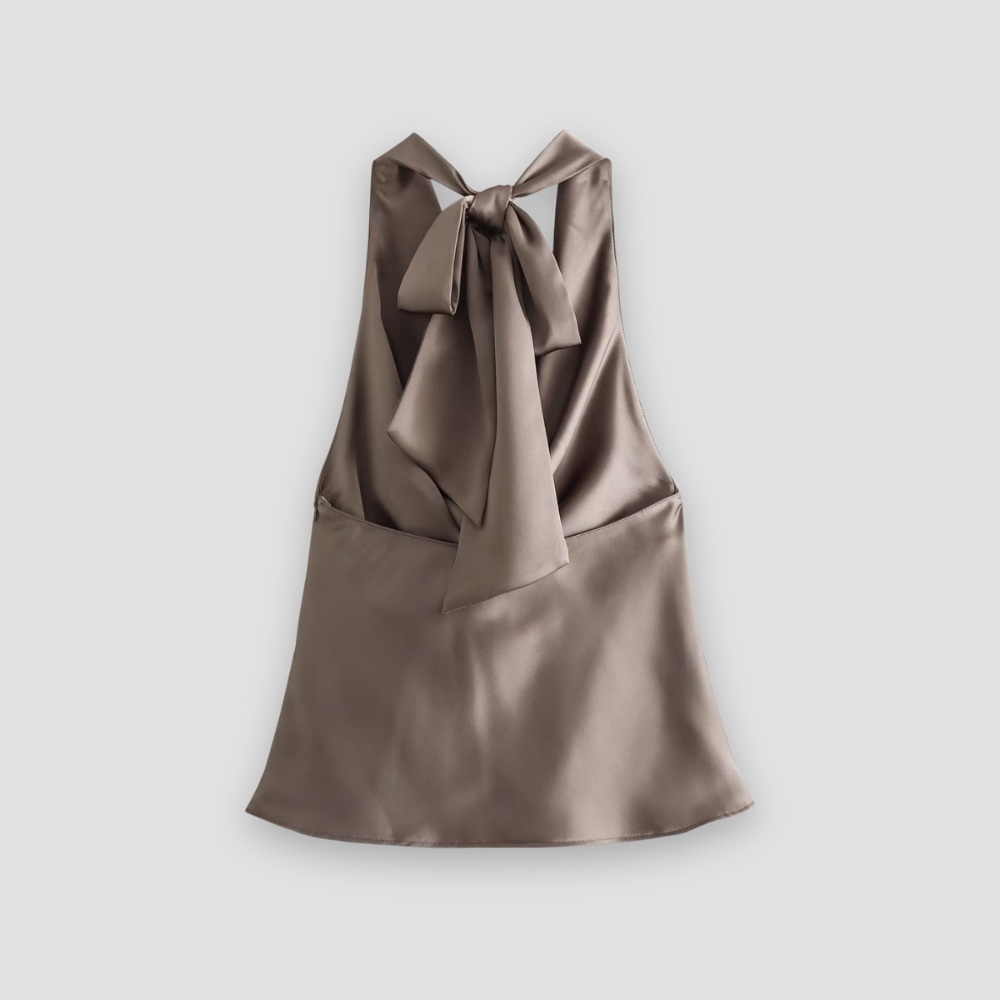 Fashionable women's halter neck tank top featuring elegant draping, a sleeveless design for summer style.
