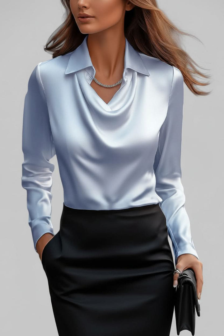 Chic women's blouse with elegant long sleeves & graceful drape, perfect for a sophisticated look.