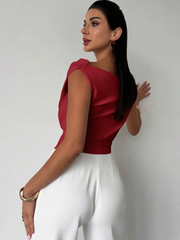 Sophisticated women's draped shoulder top, an elegant and versatile blouse for modern style.